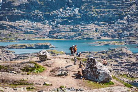 July 26, 2019. Norway tourist route on the trolltunga. People tourists go hiking in the mountains of...
