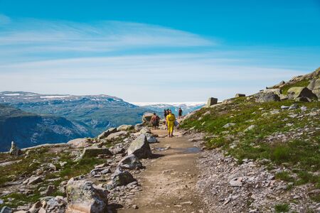 July 26, 2019. Norway tourist route on the trolltunga. People tourists go hiking in the mountains of...