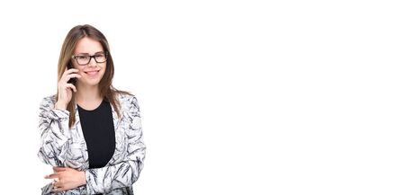 Smiling businesswoman in glasses talking on mobile phone. Beautiful young girl in Blazer on white...