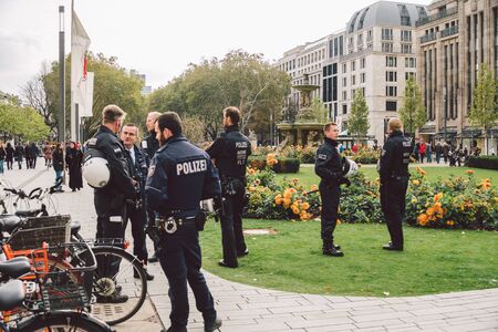 German police officer. Riot Police Germany. Police patrolling in dusseldorf October 27, 2018. German policemen Polizei at work. The subject of law enforcement, public protection, utilities in Europe.のeditorial素材