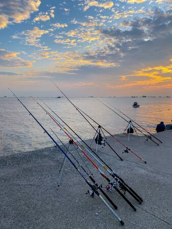 Fishermen fishing at sunset on the shores of the Sea of Marmara in Istanbul Turkey on October 28,...