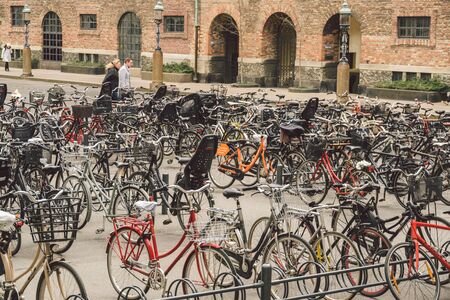 Copenhagen, Denmark. February 20, 2019. lots of Bicycles on bicycle parking in front of Danish Parliament building. Christiansborg palace. concept of healthy lifestyle and reducing carbon emissions.のeditorial素材