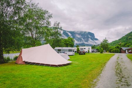 Traditional red camping houses in Lunde Camping, Norway July 21, 2019. Classical Norwegian Camping site with traditional wooden red cottages, Northern Norway. Camping cabins.のeditorial素材