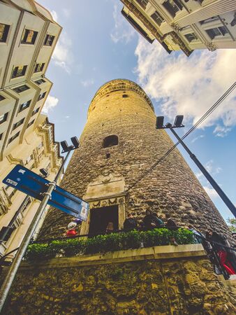 Galata Tower and the street in the Old Town of Istanbul, Turkey October 27, 2019. BELTUR Galata Kulesi or Galata tower in the old, historical part of Istanbul in the Beyoglu district.のeditorial素材