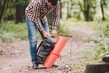 guy with backpack, traveller, hipster standing in woods, Hiking, Forest, Journey. Caucasian tourist...