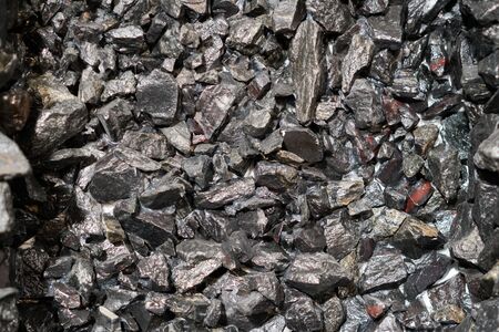 Close up view of the iron ore. rough Hematite, iron Kidney Ore stone. Pieces of ferrotitanium...