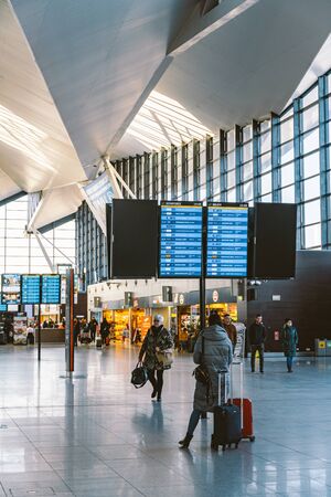 Arrivals board at Gdansk, Poland, February 14, 2020 airport. Terminal of Gdansk airport (GDN) in Poland. Interior of modern terminal Lech Walesa Airport in Gdansk. Arrival departure board at terminal.のeditorial素材