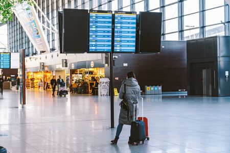 Arrivals board at Gdansk, Poland, February 14, 2020 airport. Terminal of Gdansk airport (GDN) in Poland. Interior of modern terminal Lech Walesa Airport in Gdansk. Arrival departure board at terminal.のeditorial素材