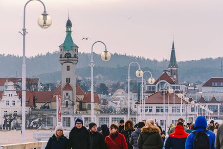 Sopot Pier Molo in the city of Sopot, Poland February 9, 2020. Cold winter day on famous old wooden pier in Sopot, located on Baltic sea. People walking on the longest wooden pier in Europe in Sopot.のeditorial素材