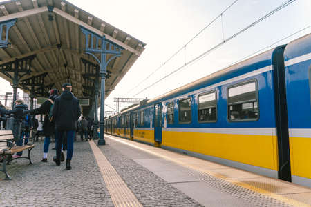 Regional new blue yellow train arriving to gdansk glowny railway station in Poland, Gdansk February...
