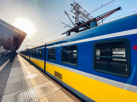 Regional new blue yellow train arriving to gdansk glowny railway station in Poland, Gdansk February...