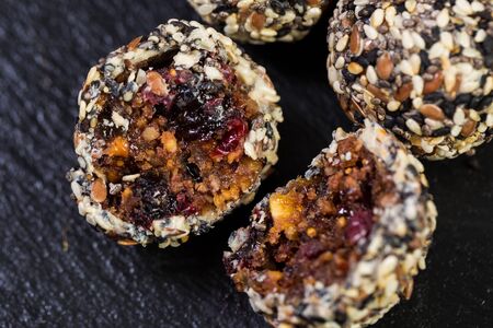 Theme sweet dessert made from natural products without sugar. Macro close-up of deserts ball round...