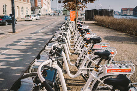 Bycyklen. Electric rental bikes in Copenhagen. row of Bycyklen bicycles. Public electric bikes for rent parked in Copenhagen February 18, 2019, Denmark. Save CO2. e-bikes located in shared parking.のeditorial素材