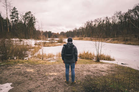 Concept of loneliness in life. Person was isolated from others connect with nature. Thinking about life. Stressful depressed emotional person with anxiety disorder mental health illness feeling bad.の写真素材