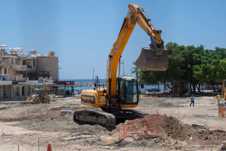 May 11, 2021 Cyprus, Paphos. Heavy machinery and construction equipment are working on renovation of...