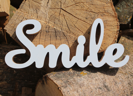 positive smile text on wood backgroundの写真素材