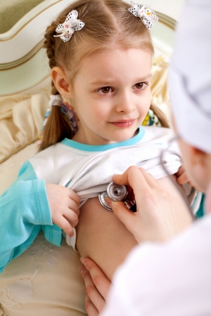 examination of a sick child at home pediatricianの写真素材