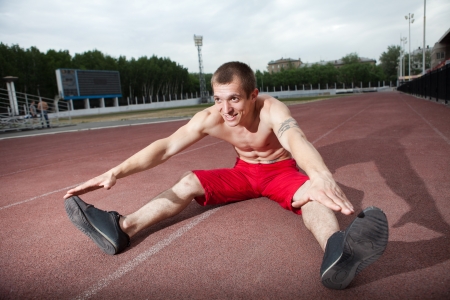 the athlete sits on a treadmillの写真素材