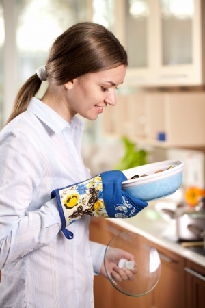 young cook dinner in the kitchenの写真素材