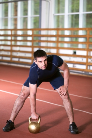 man goes in for sports in sport hallの写真素材