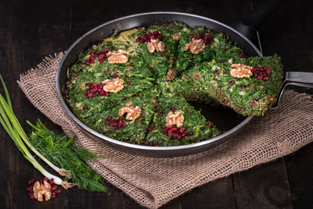 Persian Mixed herbs frittata with barberry and walnut in pan (Kuku and Zereshk)の素材 [FY31098883463]