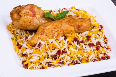 Close up shot of Saffron Rice and Barberries (Zereshk polo) with Chicken Persian and Iranian food and cuisineの写真素材