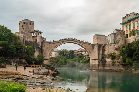 Old Bridge Of Mostar City With Emerald River Neretva In Southern Part Of Bosnia-Herzegovina In Eastern Europe Where West Meets Eastの写真素材
