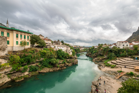 The World Heritage Site Old Bridge Of Mostar City With Emerald River Neretva In Southern Part Of  Bosnia-Herzegovina In Eastern Europe Where West Meets Eastの写真素材
