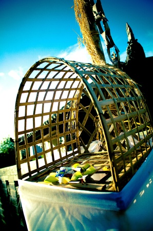 An traditional offering box in the streets of Baliの写真素材