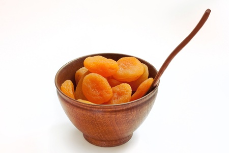 Dried apricot on the wooden dishの写真素材