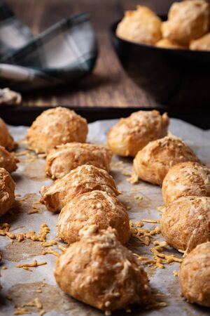 French pastry called "gougeres" presented on baking paperの写真素材