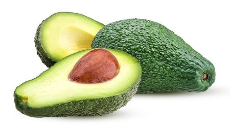 Avocado whole and cut in half with bone isolated on white backgroundの写真素材