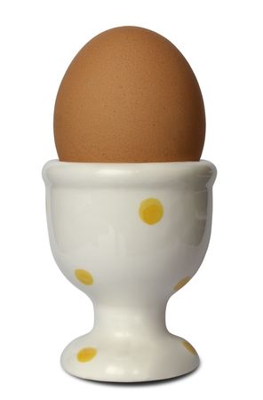 Brown egg in a cap isolated on white backgroundの写真素材