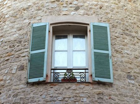 Window on medieval stone wall - Antibes, Franceの写真素材