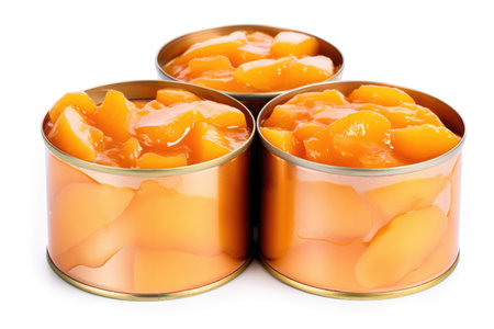 Canned peach slices on white backgroundの素材