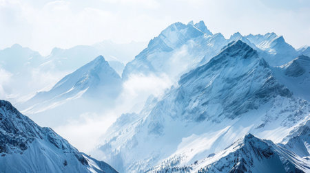 The serene beauty of the Alps adorned with pristine snow covering the towering peaksの素材