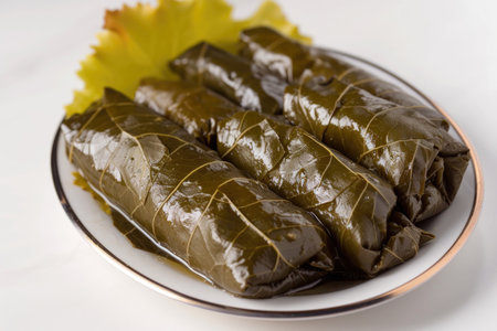 A Dolma, where stuffed grape leaves take center stage on a white backgroundの素材