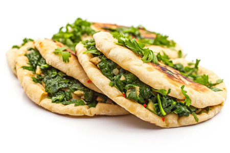 A Zhingyalov Hats, a traditional Armenian flatbread filled with an assortment of fresh greensの素材