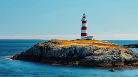 A majestic lighthouse standing tall on a remote islandの素材