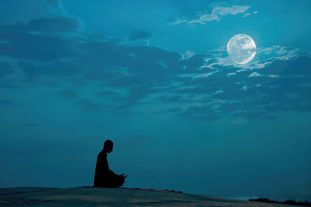A lone figure in prayer beneath the moonlit Ramadan skyの素材