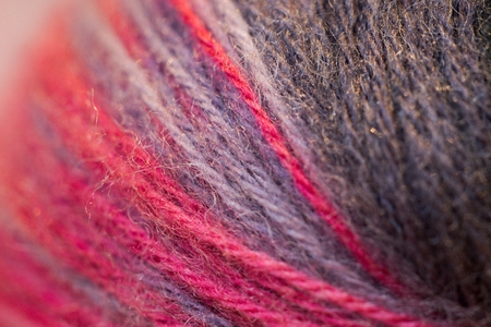Red cotton on sewing detail background