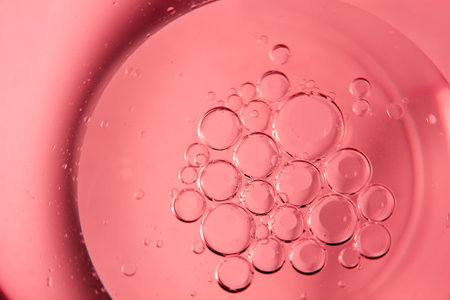 Red bubbles and drops of water on a white background star from an American flag.の写真素材
