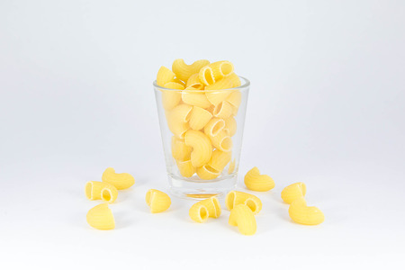 Raw macaroni in the glass
