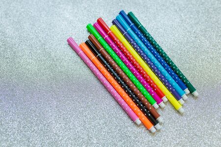 Colorful pen set on glitter backgroundの写真素材