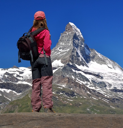 girl looking at the beautiful Mount Matterhorn in the Swiss Alps の写真素材