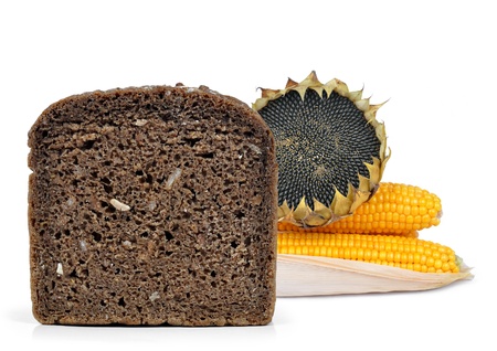 Whole wheat bread on the background corn and sunflower の写真素材