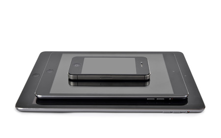 Plzen,Czech Republic - October 11, 2014 : iPad air ,iPad mini and iPhone 4S Smart Phone developed by...