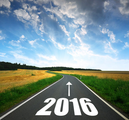 Asphalted road at sunset .Forward to the New Year 2016