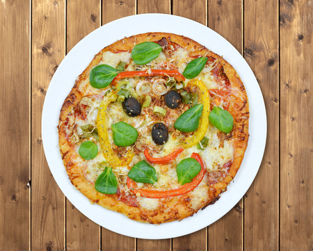 Italian pizza with olives on wooden tableの写真素材