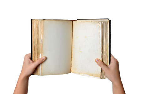 Open old blank book in hands isolated on white backgroundの写真素材